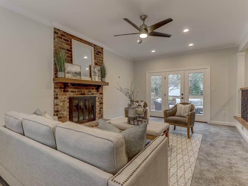 4234 Chevington Road Charlotte, NC 28226 - Photo 20 of 46 a living room with furniture and a fireplace
