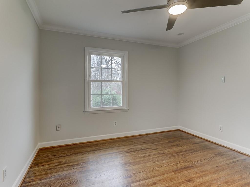4234 Chevington Road Charlotte, NC 28226 - Photo 35 of 46 wooden floor in an empty room with a window