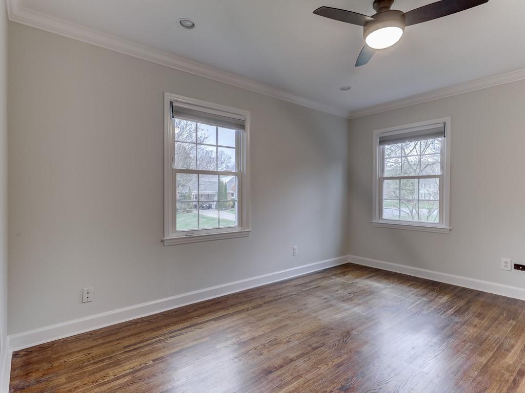 4234 Chevington Road Charlotte, NC 28226 - Photo 37 of 46 a view of an empty room with wooden floor and a window