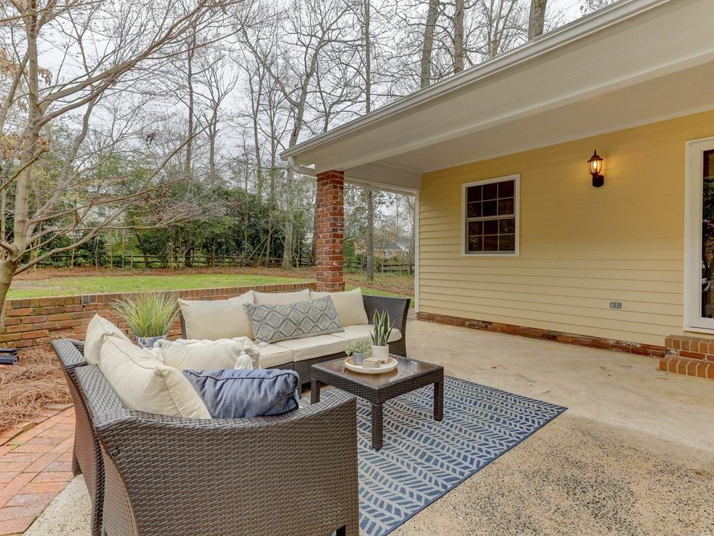 4234 Chevington Road Charlotte, NC 28226 - Photo 41 of 46 a view of a patio with couches chairs and a fire pit