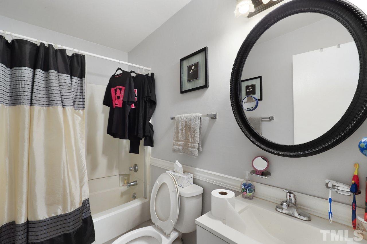 4541 Hargrove Road Raleigh, NC 27604 - Photo 18 of 24 a bathroom with a sink and a mirror