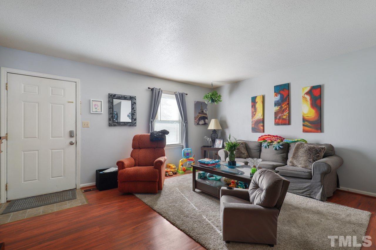 4541 Hargrove Road Raleigh, NC 27604 - Photo 5 of 24 a living room with furniture and a window