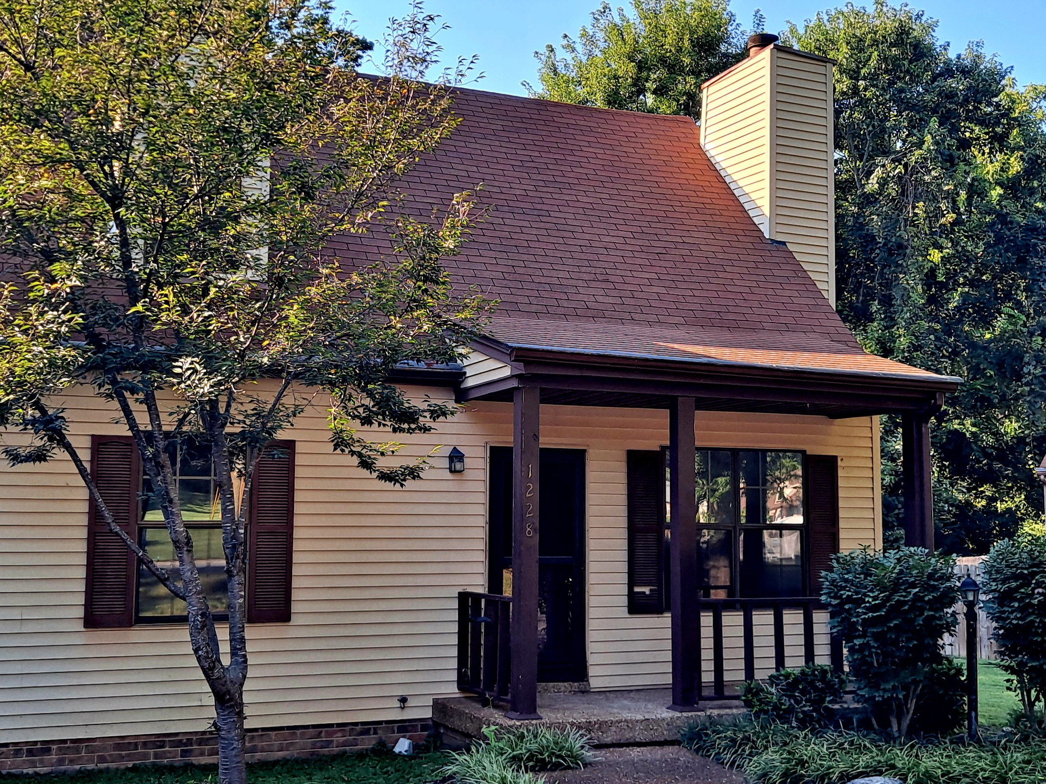 1228 Quail Road Nashville, TN 37214 - Photo 1 of 23 a front view of a house with garden