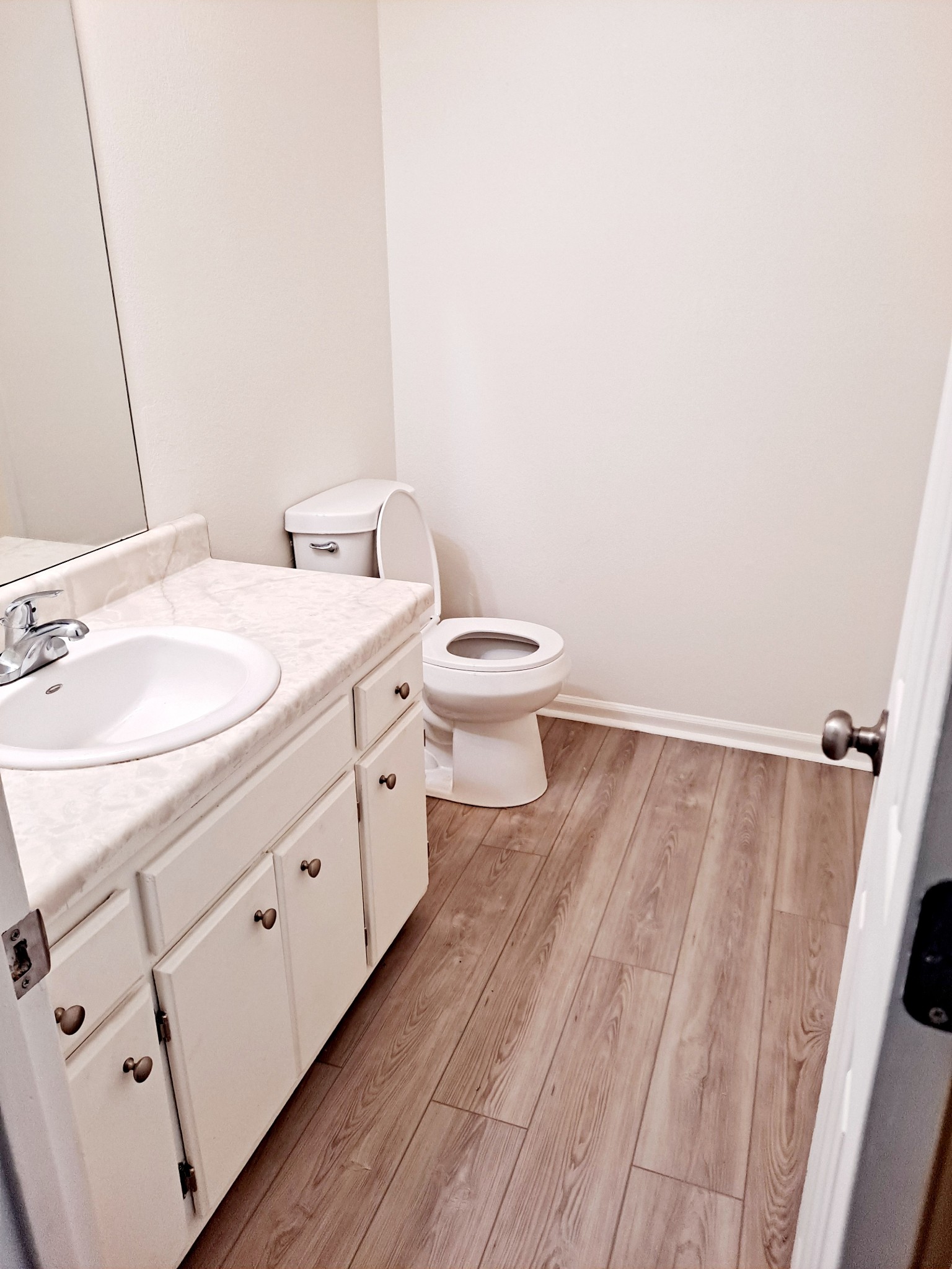 1228 Quail Road Nashville, TN 37214 - Photo 18 of 23 a bathroom with a granite countertop toilet sink and mirror