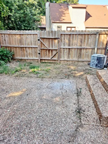 a backyard of a house with a yard