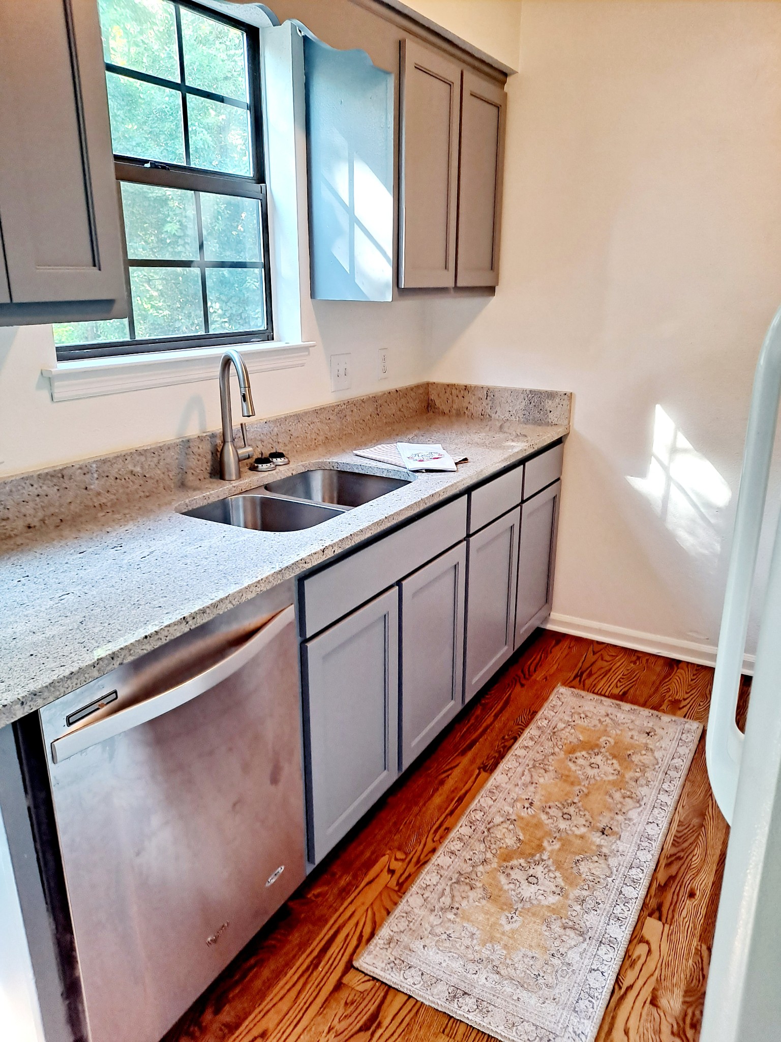 1228 Quail Road Nashville, TN 37214 - Photo 5 of 23 a kitchen with stainless steel appliances granite countertop a sink stove and cabinets