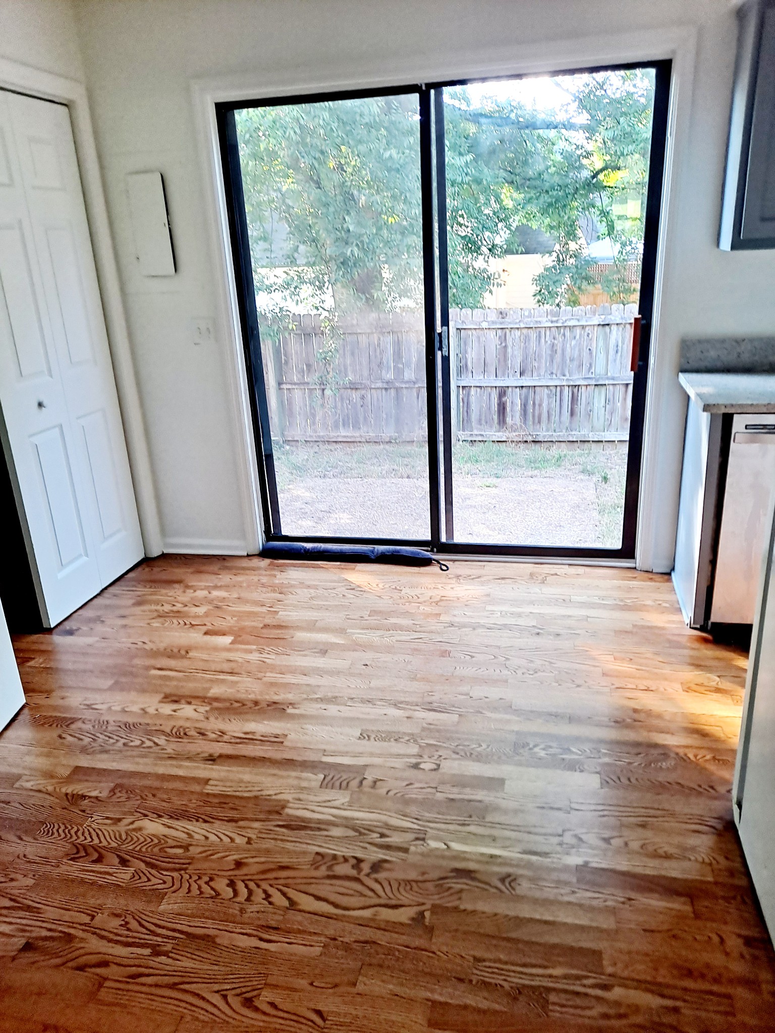 1228 Quail Road Nashville, TN 37214 - Photo 9 of 23 a view of an empty room with wooden floor and a window