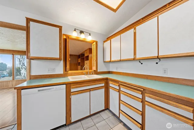 a kitchen that has a sink and a window