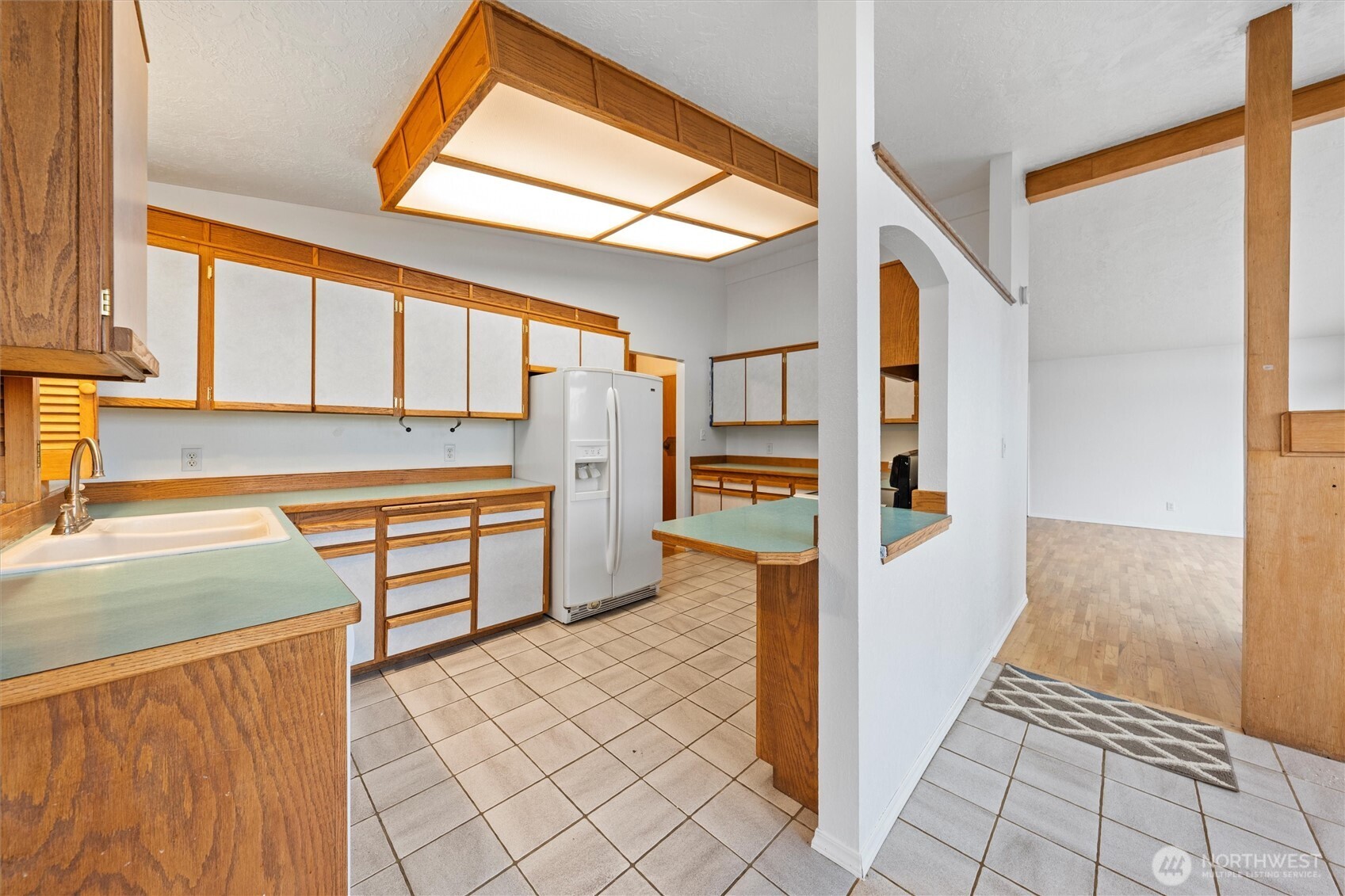 401 Statter Road Ephrata, WA 98823 - Photo 21 of 40 a kitchen with stainless steel appliances kitchen island granite countertop a refrigerator and a sink
