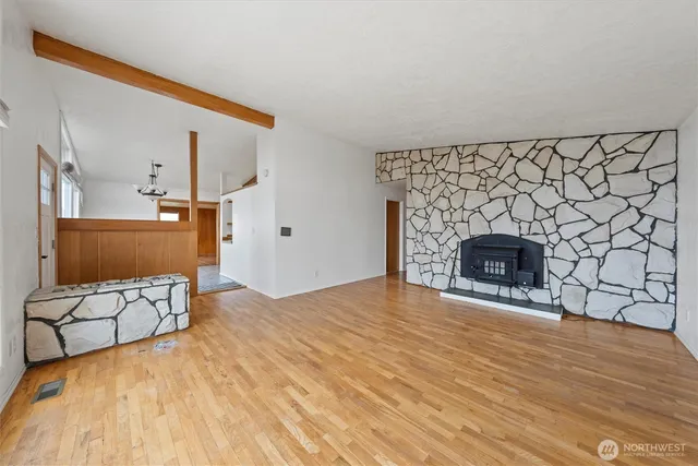 a view of a livingroom with furniture and a fireplace