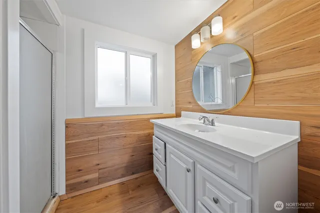 a bathroom with a sink and a mirror
