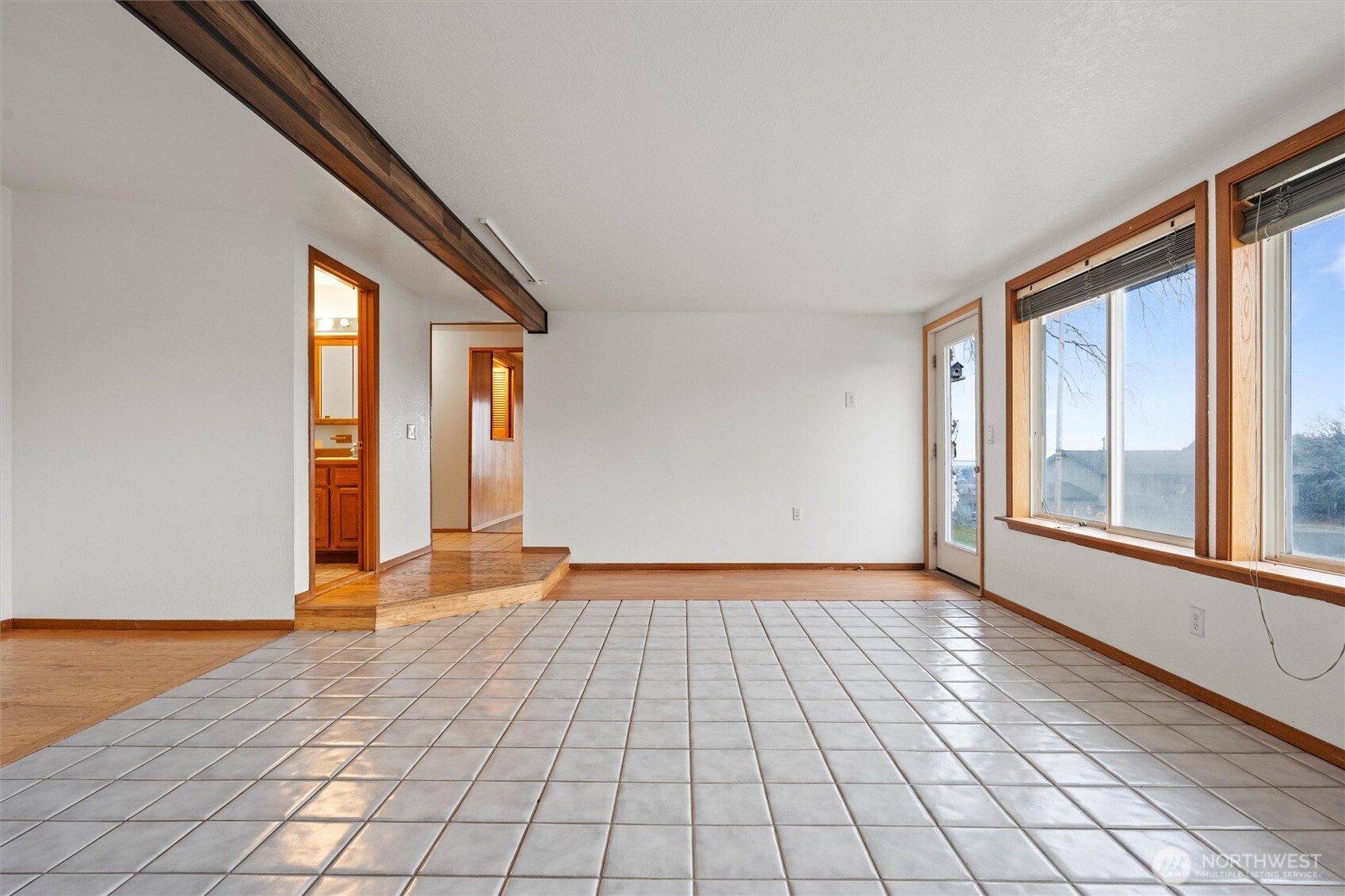401 Statter Road Ephrata, WA 98823 - Photo 7 of 40 a view of an empty room with window and wooden floor
