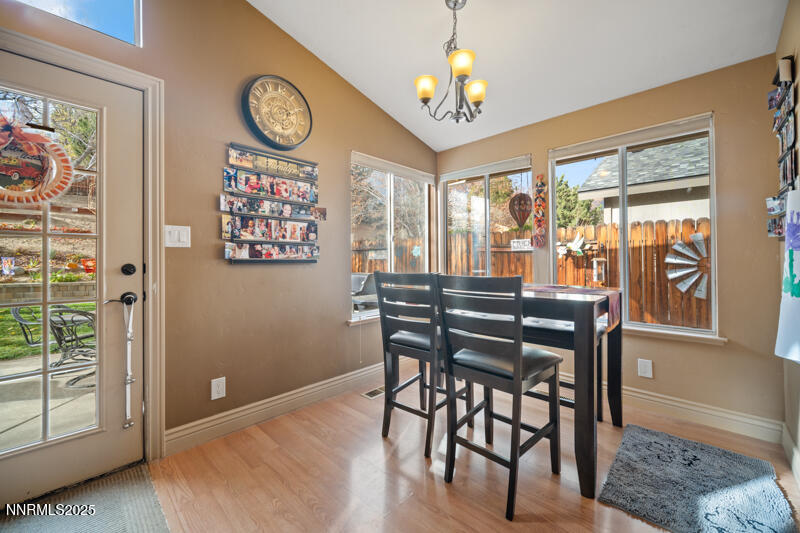 2215 Gatewood Drive Reno, NV 89523 - Photo 14 of 37 a view of a dining room with furniture window and wooden floor