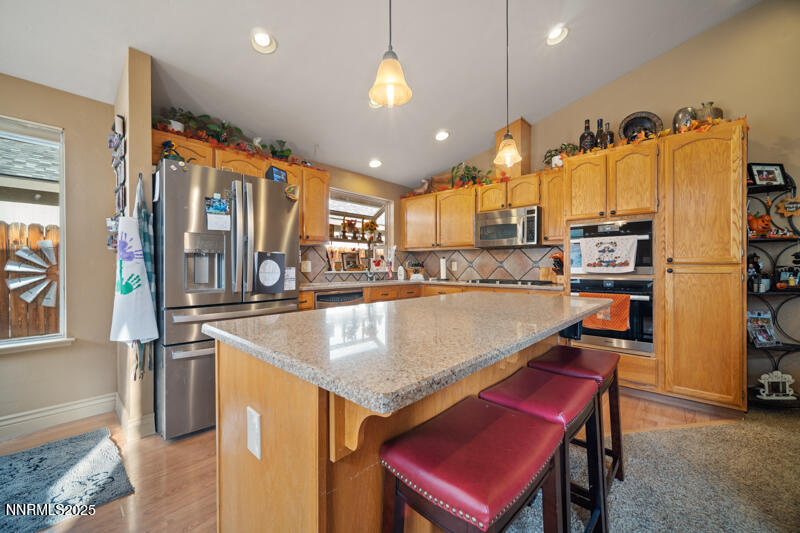 2215 Gatewood Drive Reno, NV 89523 - Photo 16 of 37 a kitchen with stainless steel appliances granite countertop a refrigerator a sink and a stove