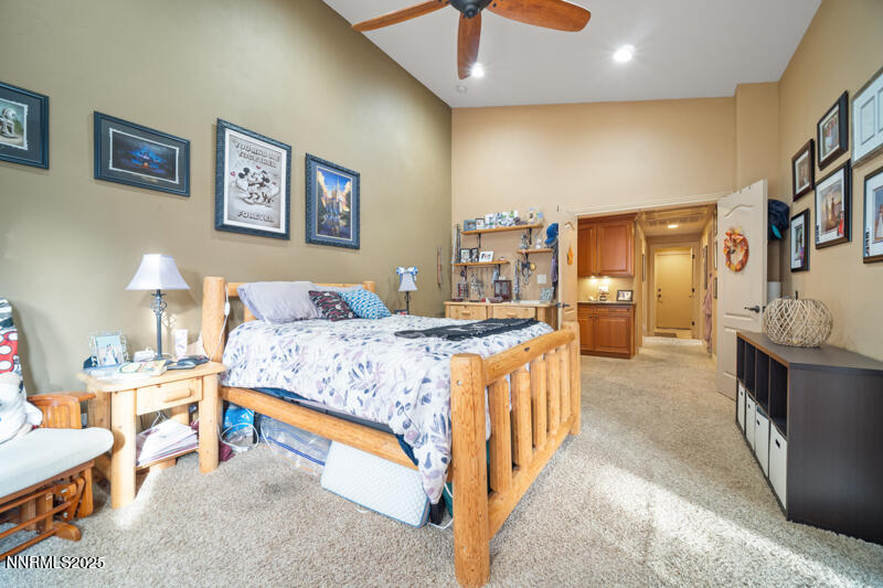 2215 Gatewood Drive Reno, NV 89523 - Photo 21 of 37 a spacious bedroom with a bed and a lamp