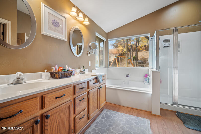 2215 Gatewood Drive Reno, NV 89523 - Photo 23 of 37 a bathroom with a tub sink and mirror