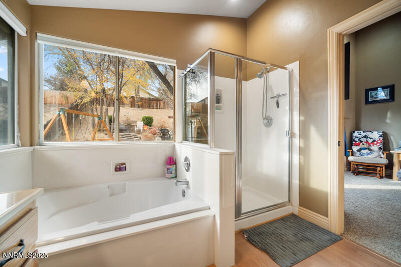 2215 Gatewood Drive Reno, NV 89523 - Photo 24 of 37 a bathroom with a bathtub and a shower