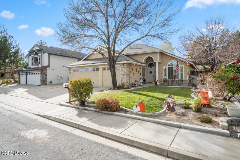 2215 Gatewood Drive Reno, NV 89523 - Photo 3 of 37 a front view of a house with a yard and potted plants