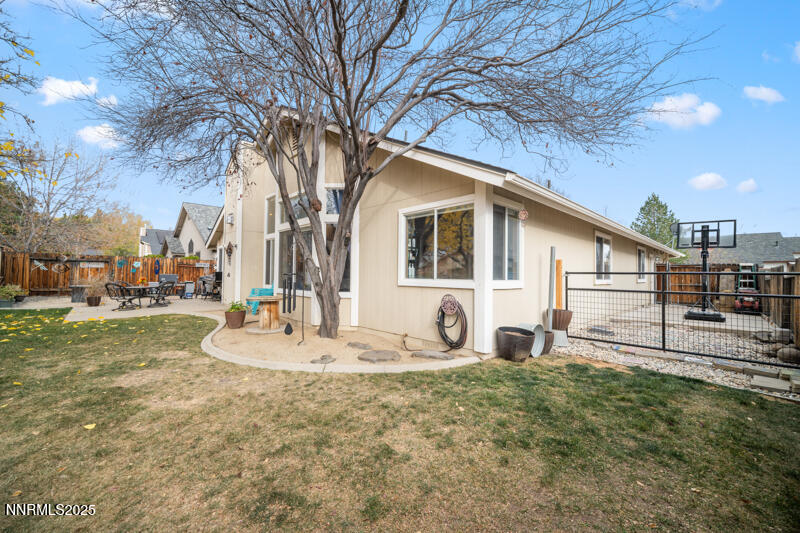 2215 Gatewood Drive Reno, NV 89523 - Photo 35 of 37 a backyard of a house with table and chairs