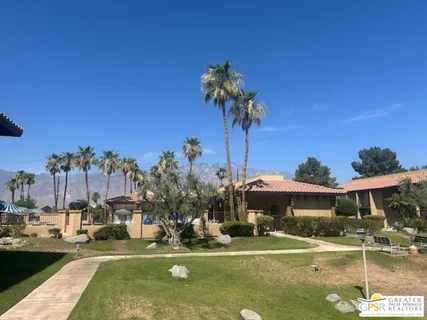a front view of a building with garden