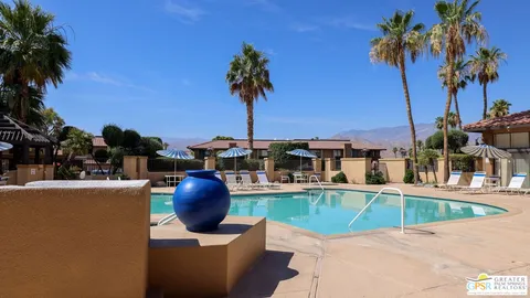 a view of a swimming pool with a lounge chair