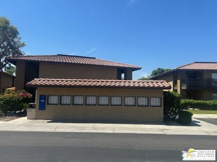 a black car parked in front of a house