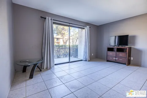 a view of room with furniture and flat screen tv