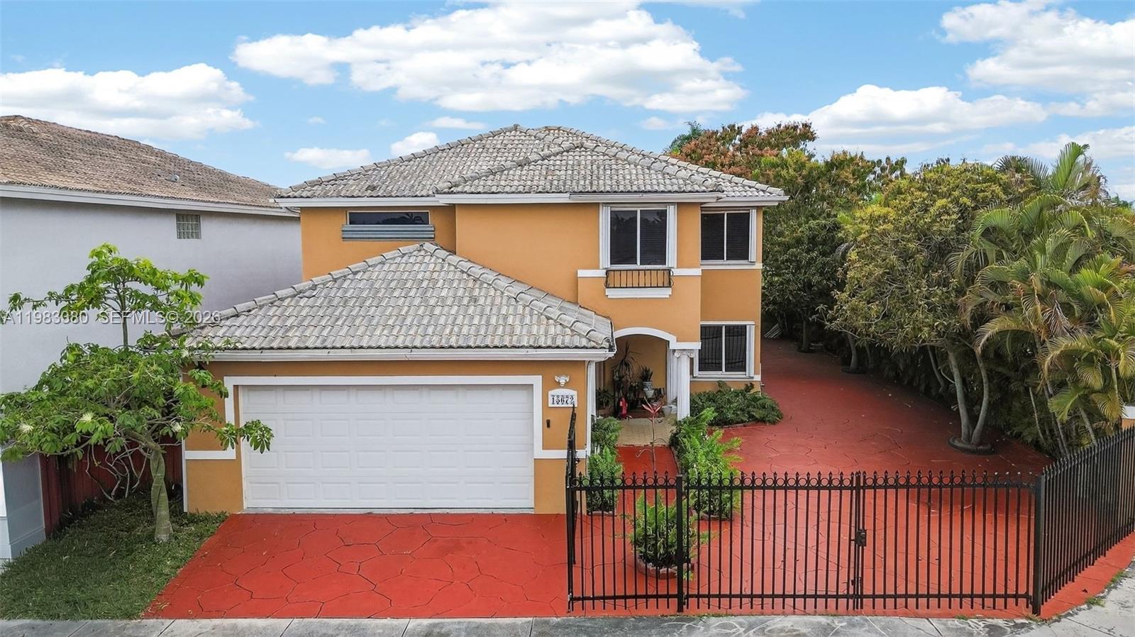a front view of a house with yard