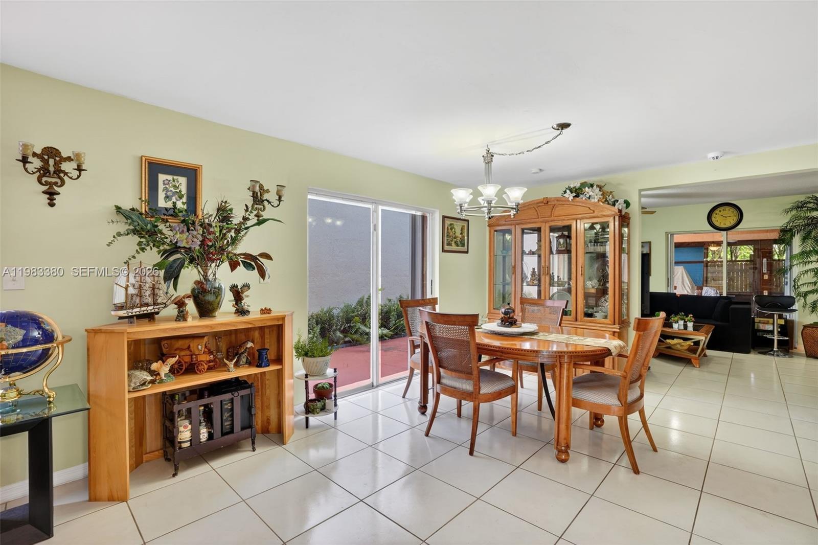 15672 Southwest 91st Lane Miami, FL 33196 - Photo 12 of 47 a view of a livingroom with furniture and window