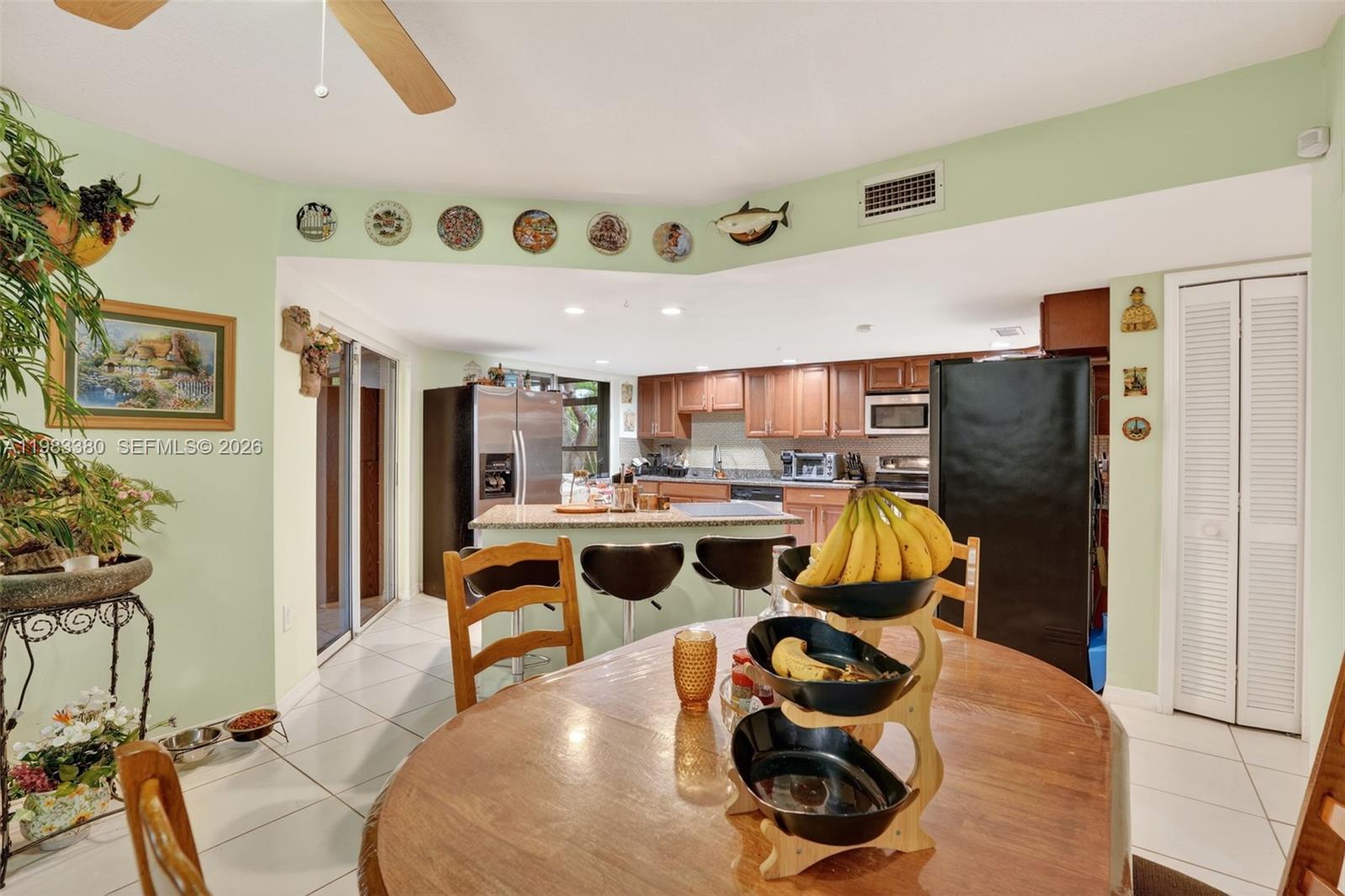 15672 Southwest 91st Lane Miami, FL 33196 - Photo 17 of 47 a living room with furniture and a window