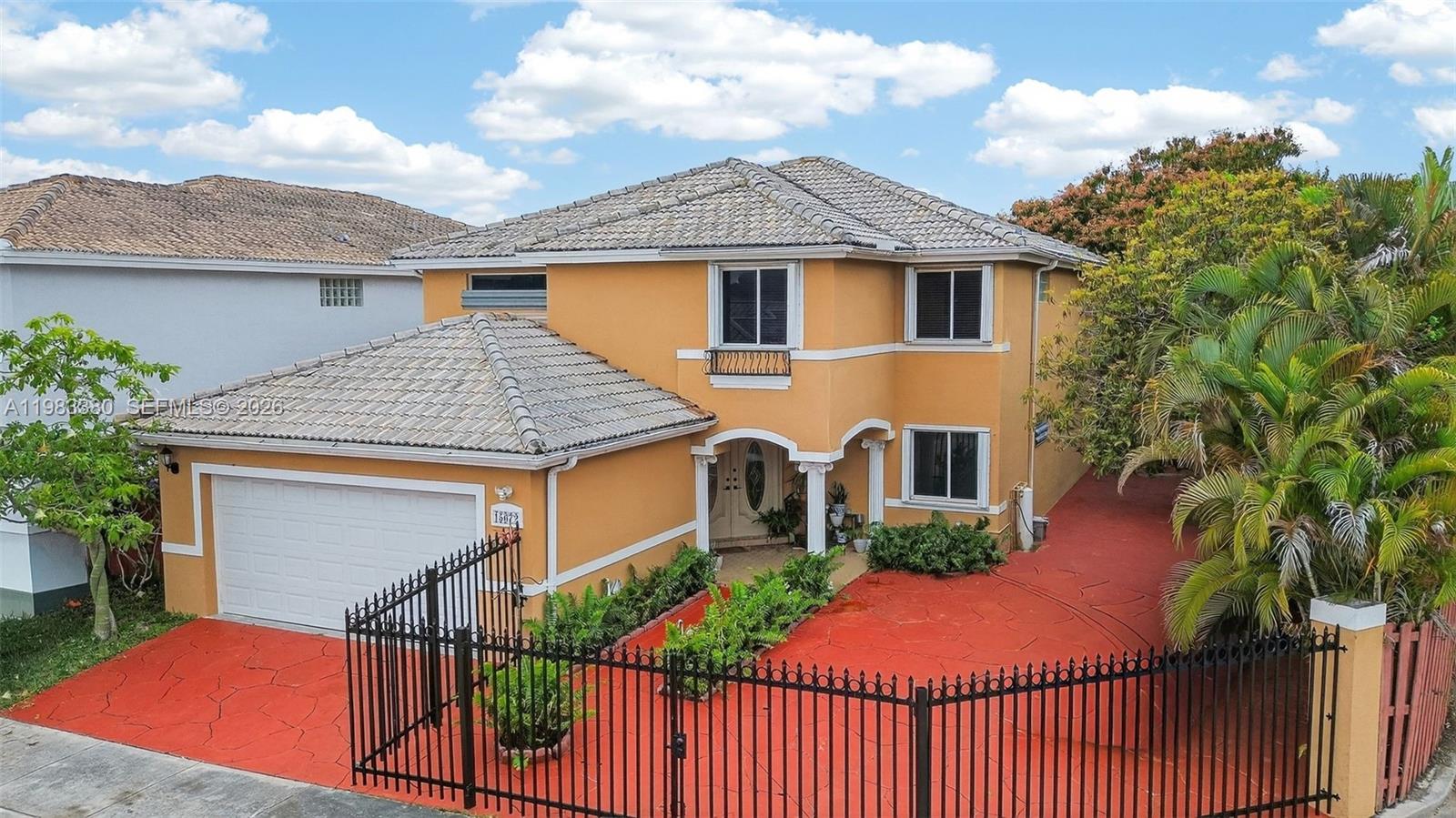 15672 Southwest 91st Lane Miami, FL 33196 - Photo 2 of 47 a front view of house with yard and trees
