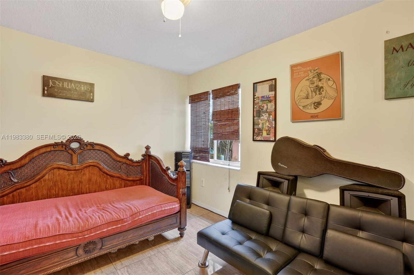 15672 Southwest 91st Lane Miami, FL 33196 - Photo 23 of 47 a bedroom with furniture and wooden floor