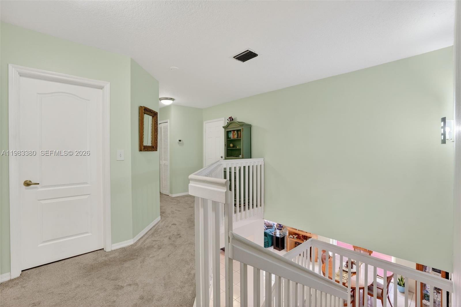 15672 Southwest 91st Lane Miami, FL 33196 - Photo 25 of 47 a view of a hallway to a room with stair