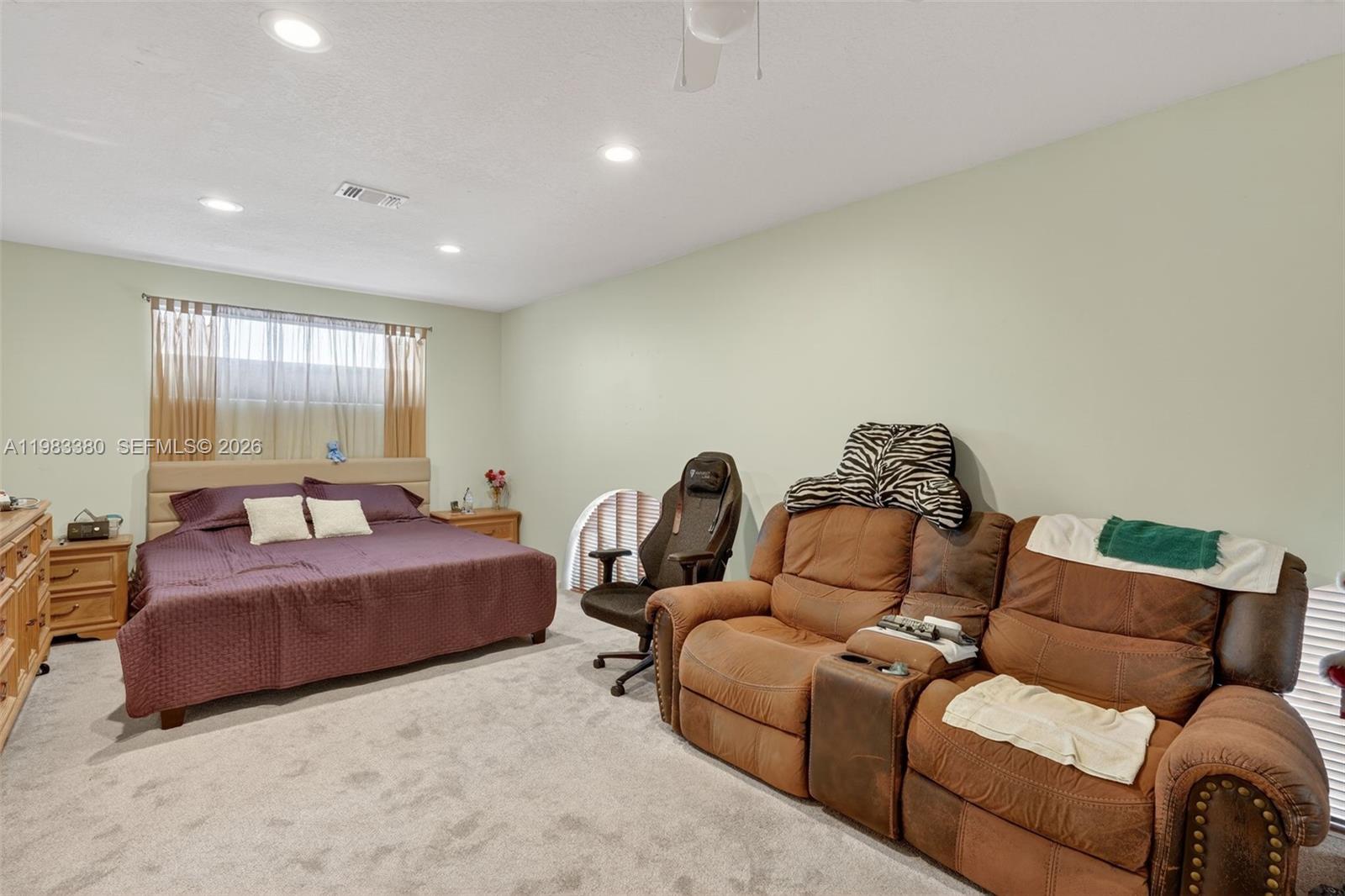 15672 Southwest 91st Lane Miami, FL 33196 - Photo 31 of 47 a living room with a couch and a window