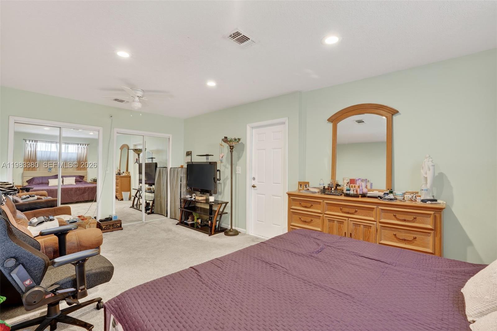 15672 Southwest 91st Lane Miami, FL 33196 - Photo 32 of 47 a bed room with a bed and furniture