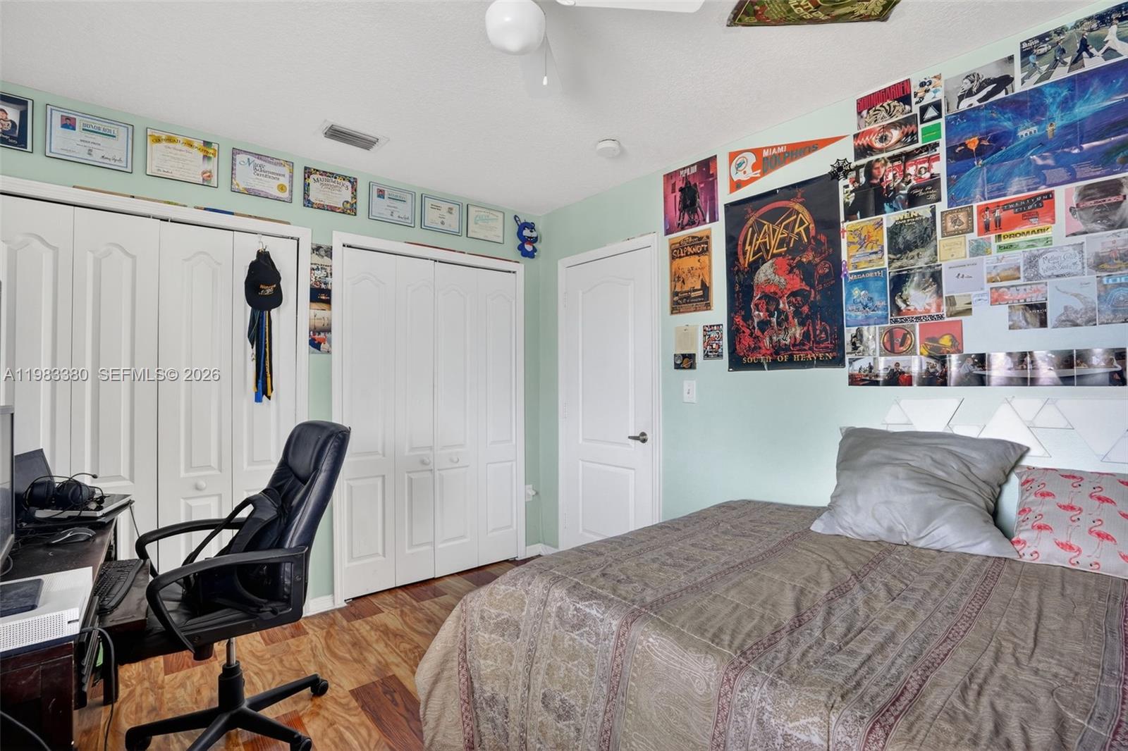 15672 Southwest 91st Lane Miami, FL 33196 - Photo 34 of 47 a bedroom with a bed and furniture