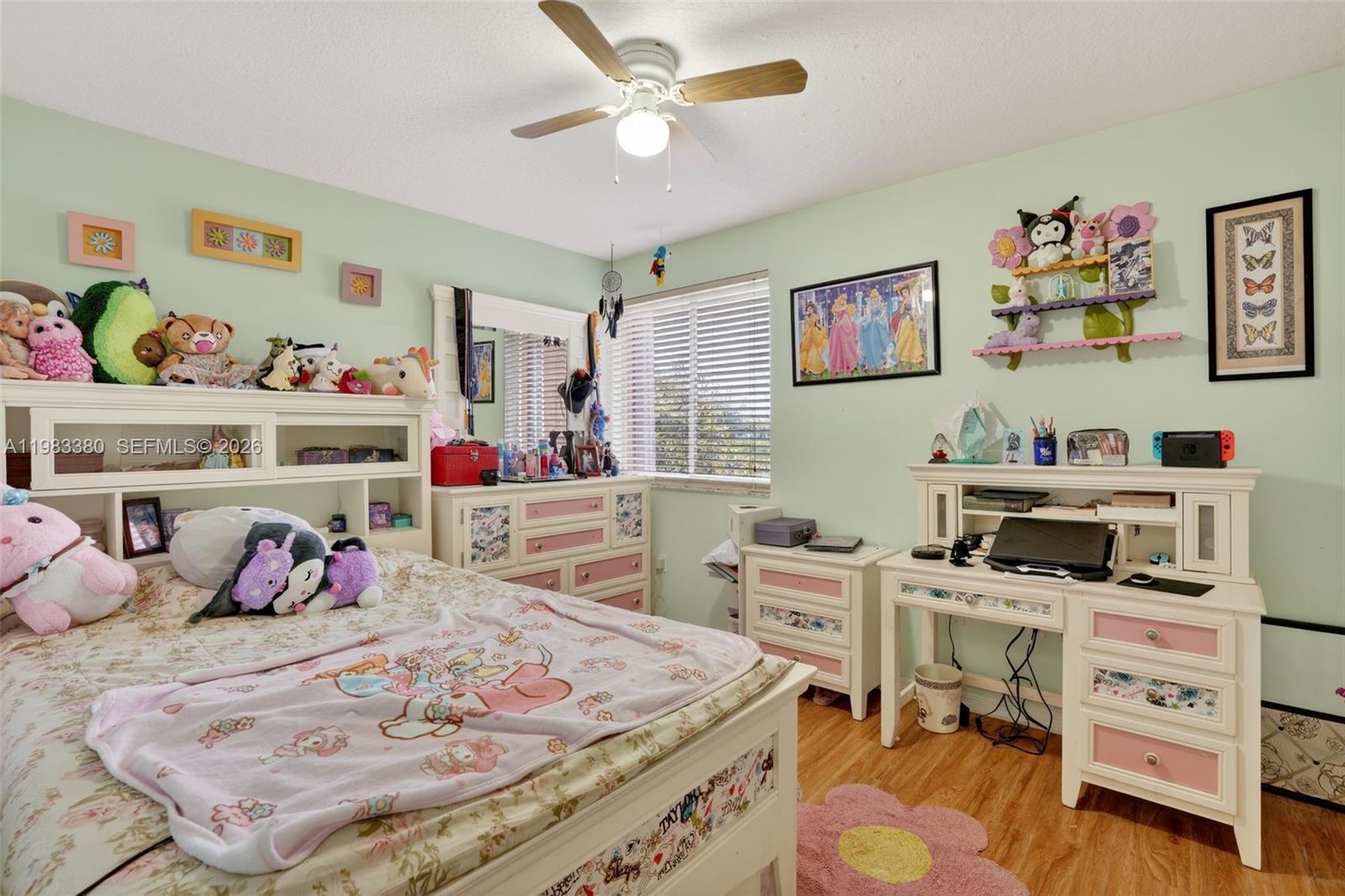 15672 Southwest 91st Lane Miami, FL 33196 - Photo 35 of 47 a bedroom with a bed and dresser