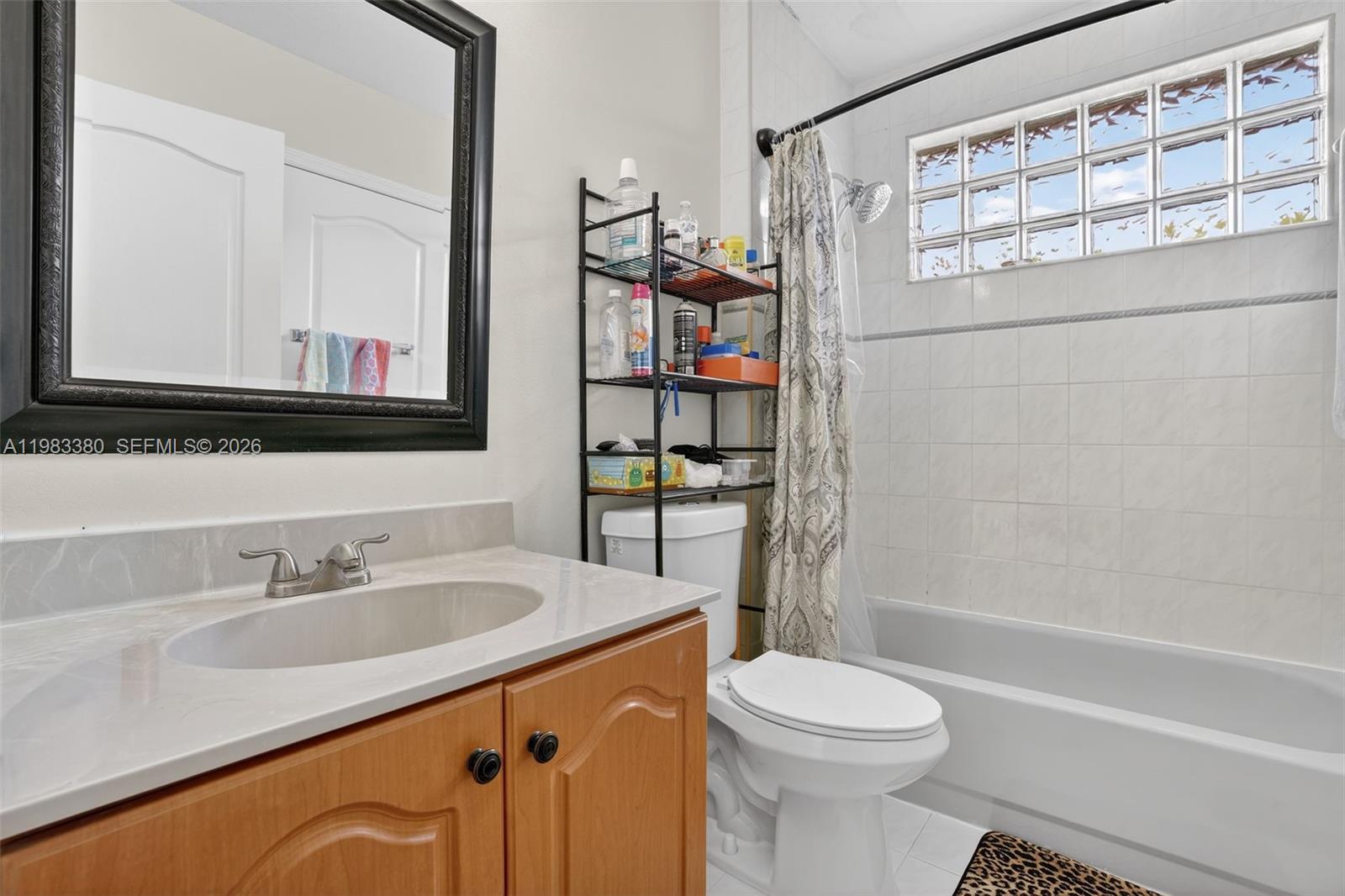15672 Southwest 91st Lane Miami, FL 33196 - Photo 37 of 47 a bathroom with a sink a toilet and shower