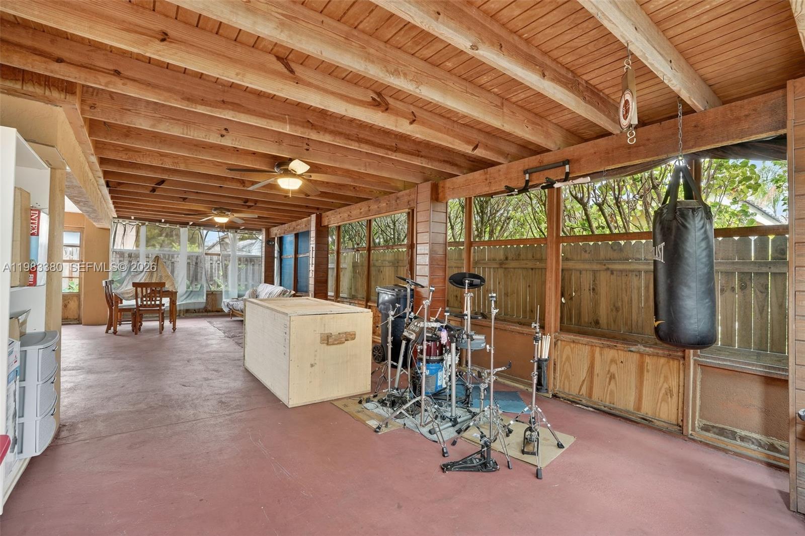 15672 Southwest 91st Lane Miami, FL 33196 - Photo 40 of 47 a view of a room with gym equipment
