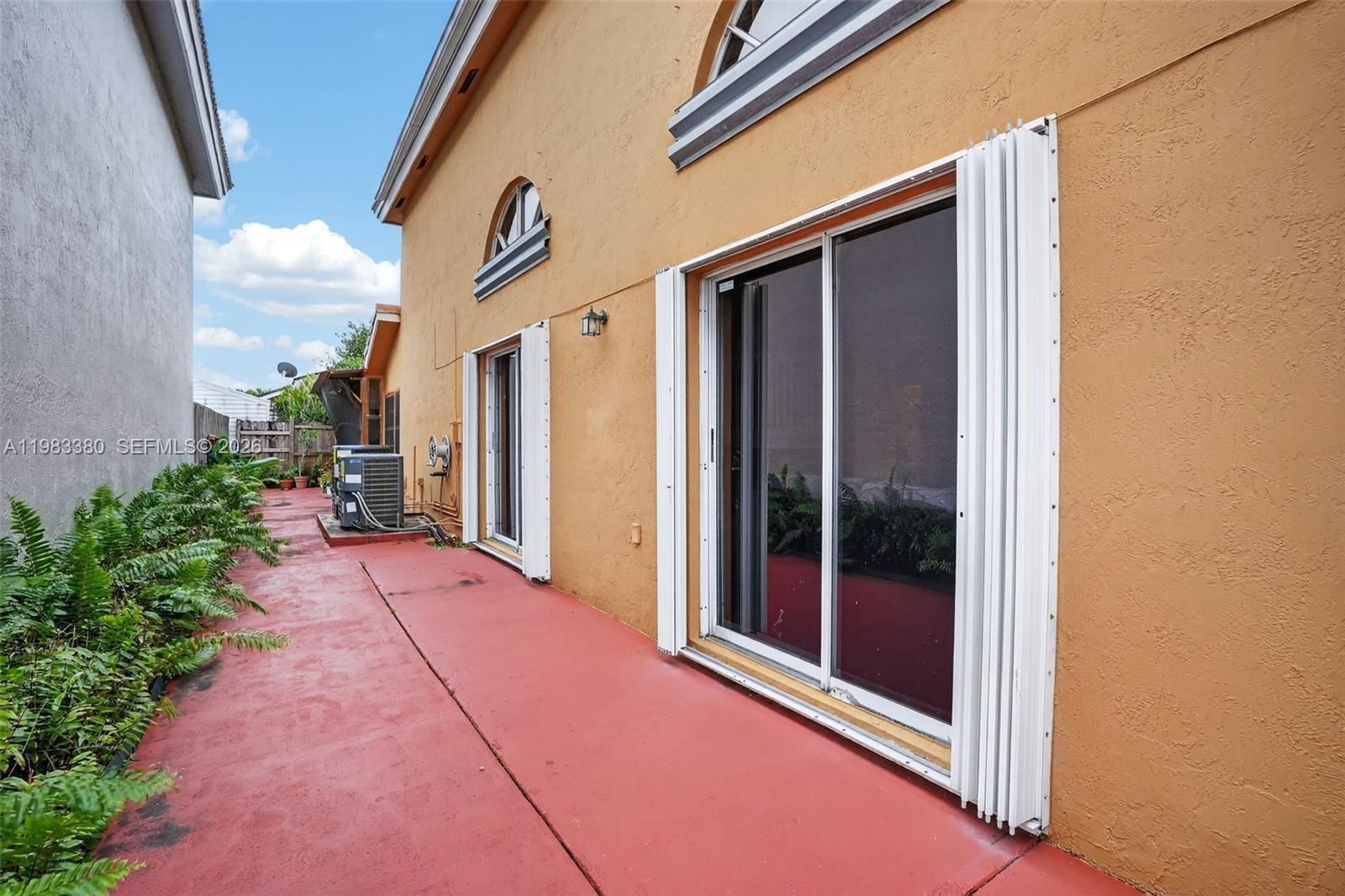 15672 Southwest 91st Lane Miami, FL 33196 - Photo 44 of 47 a view of a street with an outdoor space