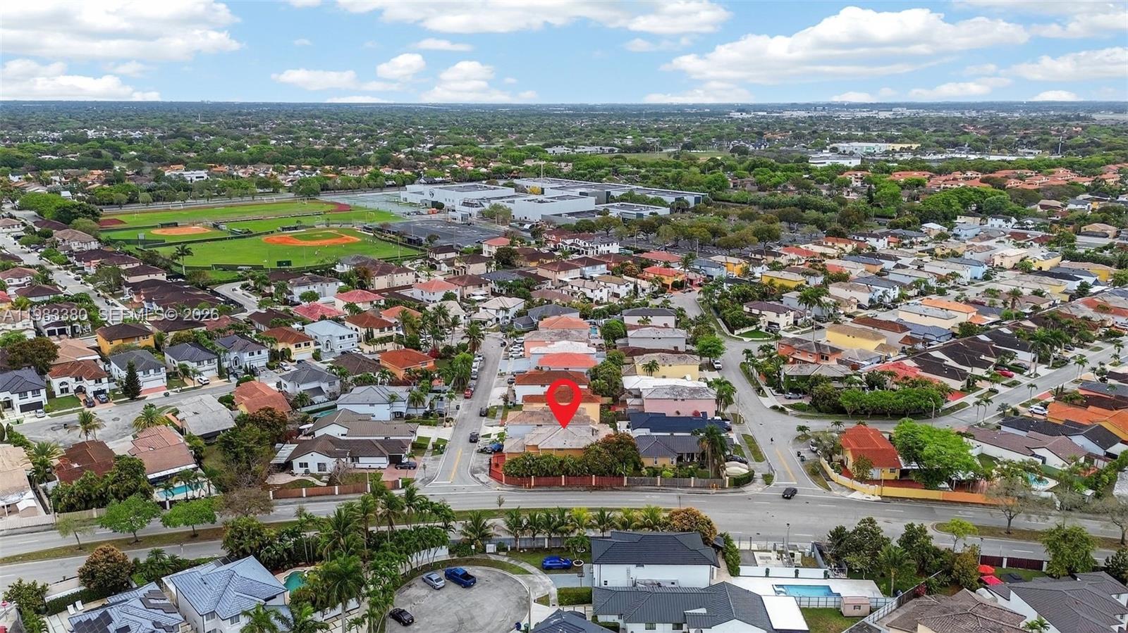 15672 Southwest 91st Lane Miami, FL 33196 - Photo 46 of 47 an aerial view of residential houses with outdoor space