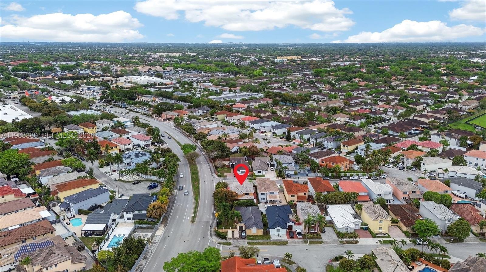 15672 Southwest 91st Lane Miami, FL 33196 - Photo 47 of 47 an aerial view of residential houses with city view