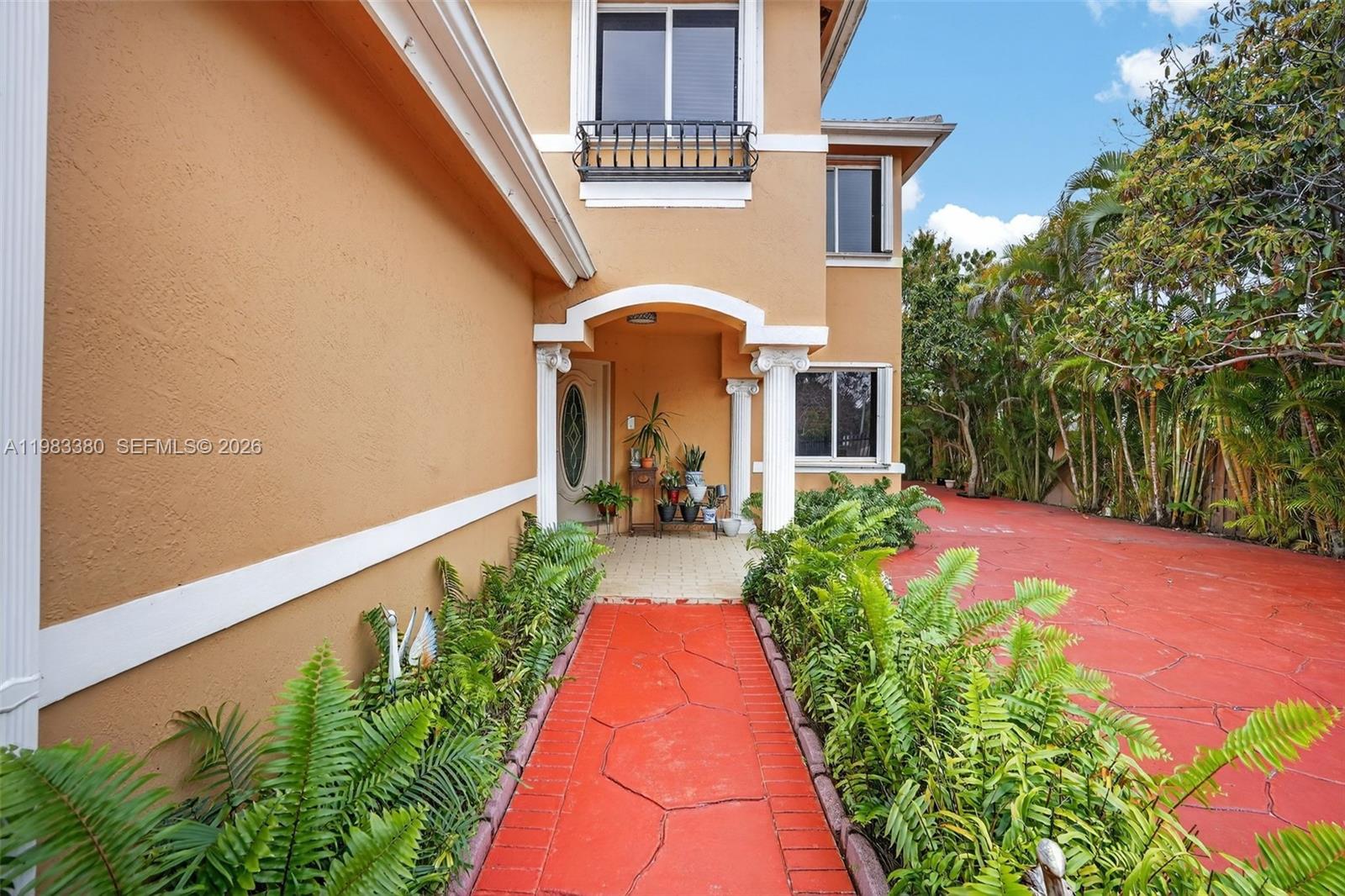 15672 Southwest 91st Lane Miami, FL 33196 - Photo 7 of 47 a view of a flower in front of a house with a big yard