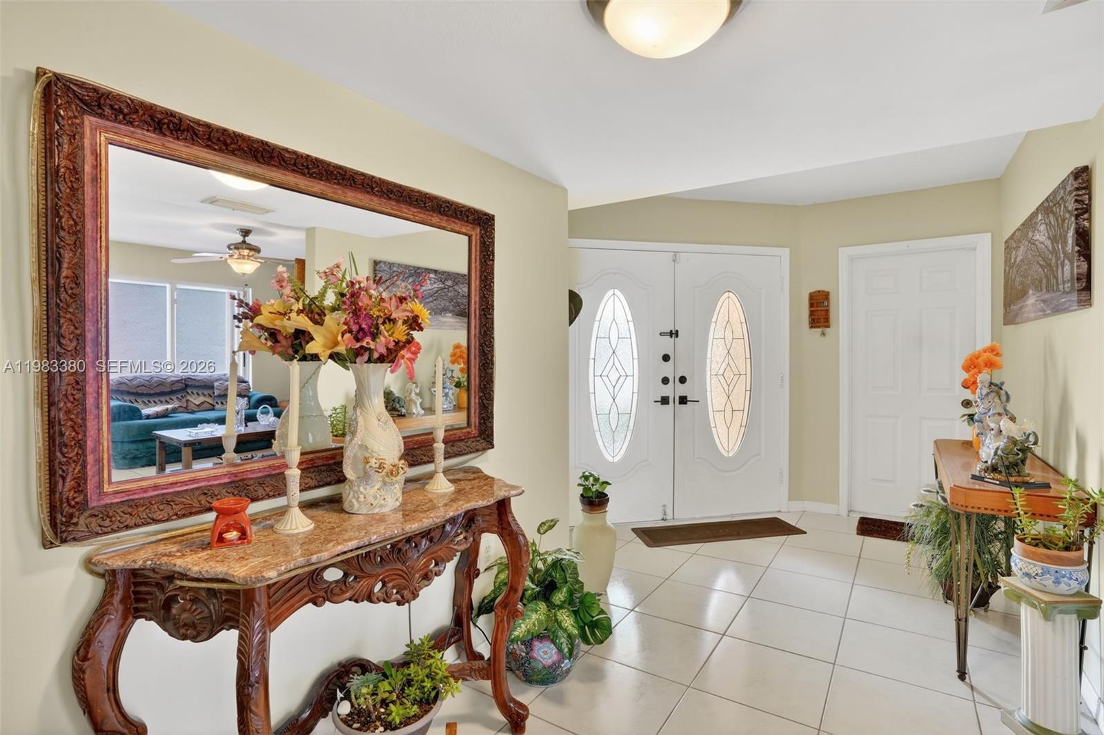 15672 Southwest 91st Lane Miami, FL 33196 - Photo 10 of 47 a dining room with table and chairs