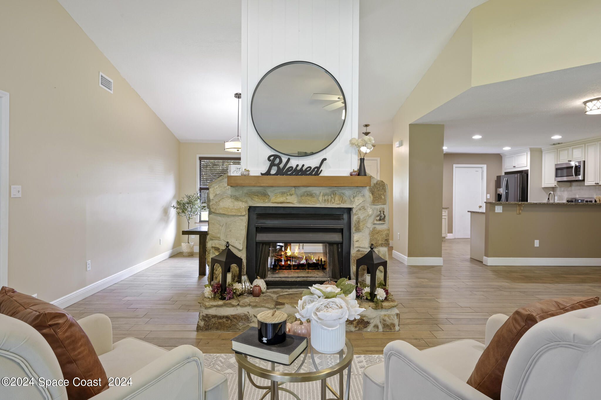 3725 Laurette Road Merritt Island, FL 32952 - Photo 11 of 46 a living room with furniture a fireplace and a window