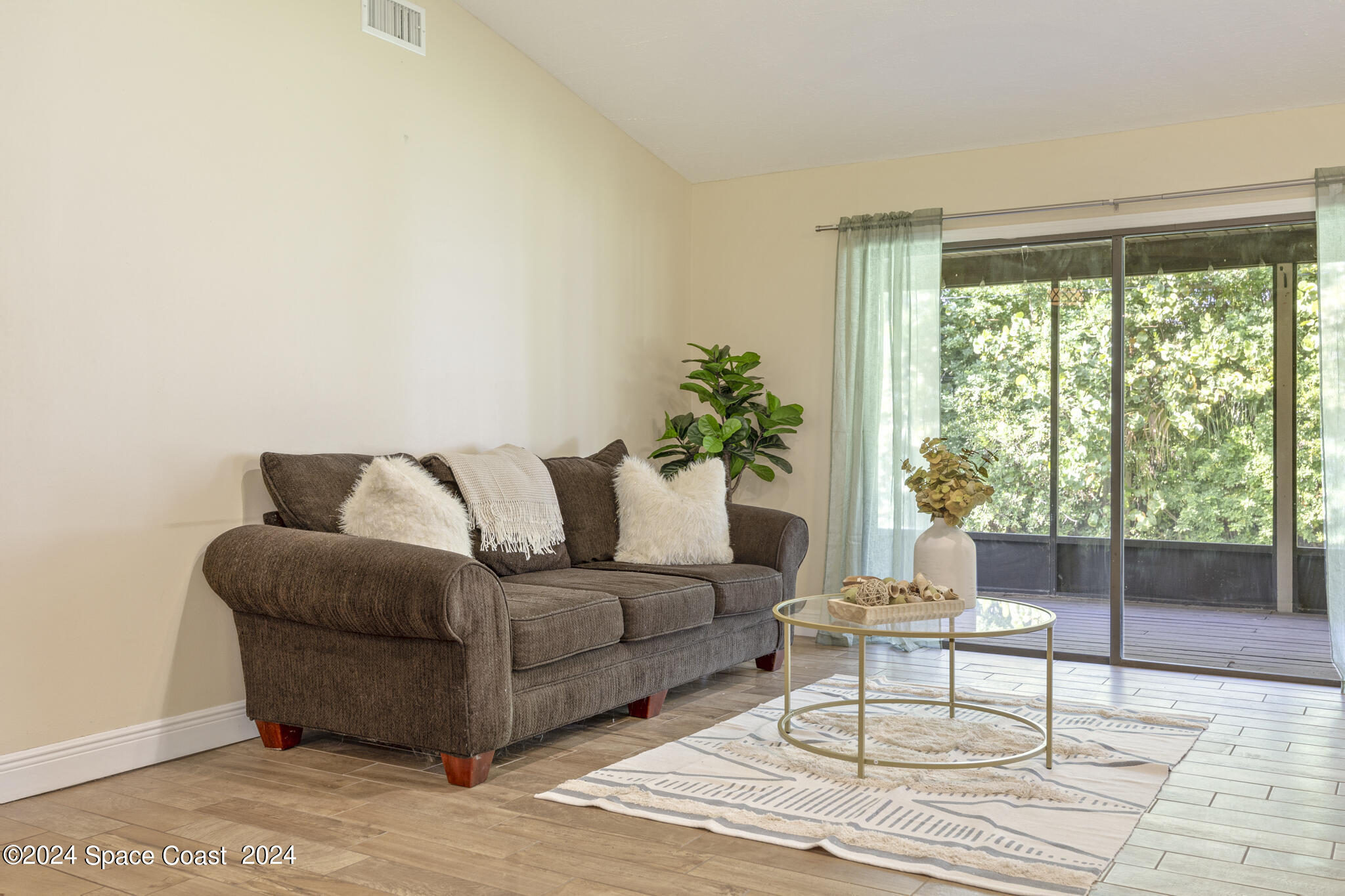 3725 Laurette Road Merritt Island, FL 32952 - Photo 12 of 46 a living room with furniture and a large window