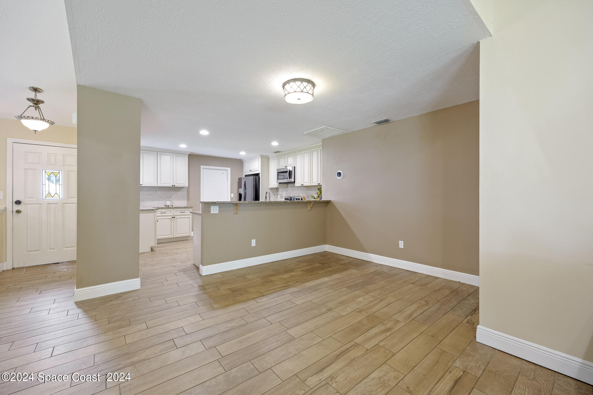 3725 Laurette Road Merritt Island, FL 32952 - Photo 18 of 46 a view of kitchen with wooden floor