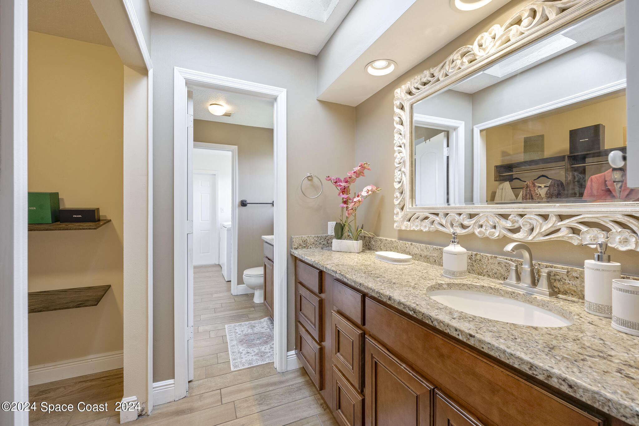 3725 Laurette Road Merritt Island, FL 32952 - Photo 23 of 46 a bathroom with a granite countertop sink and a mirror