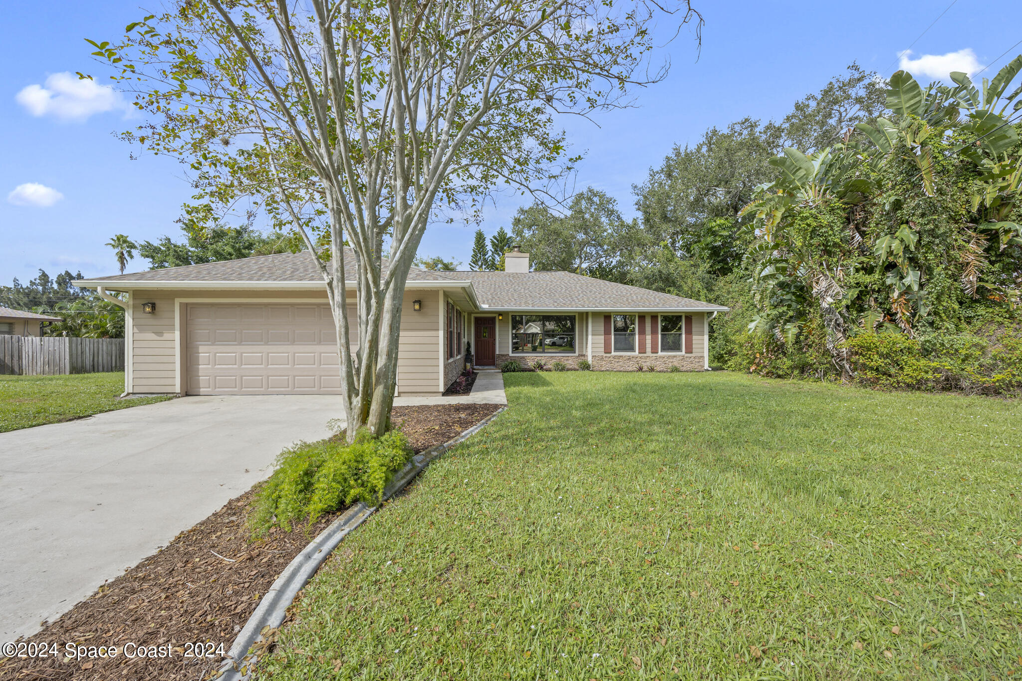 3725 Laurette Road Merritt Island, FL 32952 - Photo 3 of 46 front view of a house with a yard