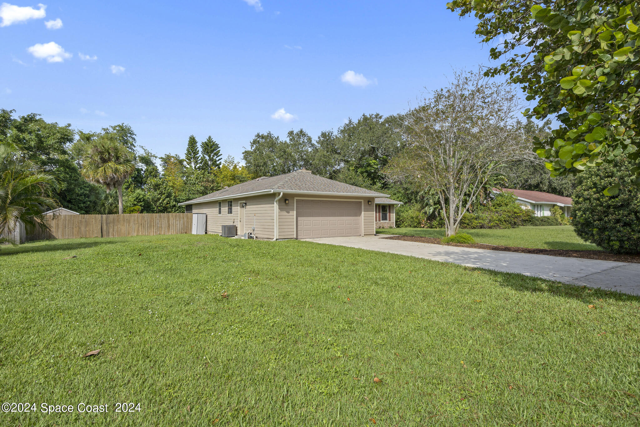 3725 Laurette Road Merritt Island, FL 32952 - Photo 40 of 46 a view of a house with backyard and garden